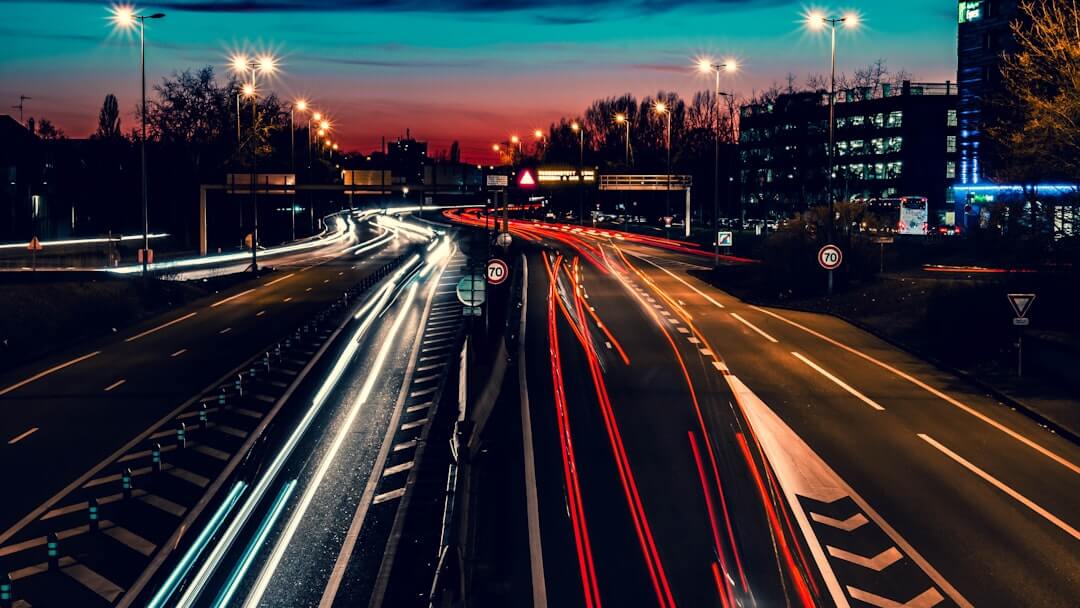 time lapse photography of road at night