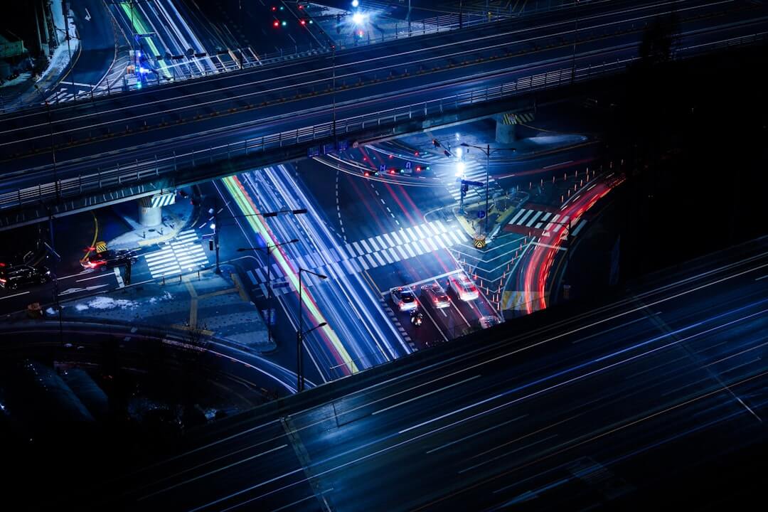 an aerial view of a city street at night
