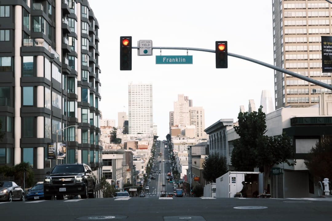 a traffic light hanging over a city street