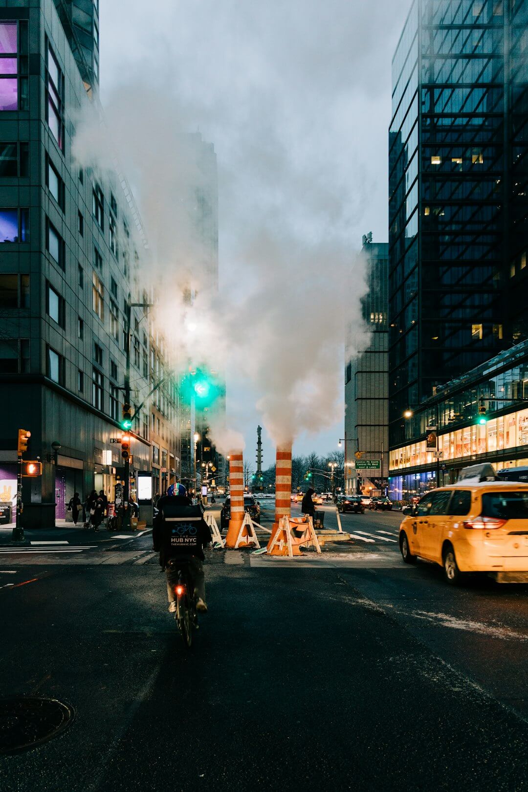a person riding a bike on a city street