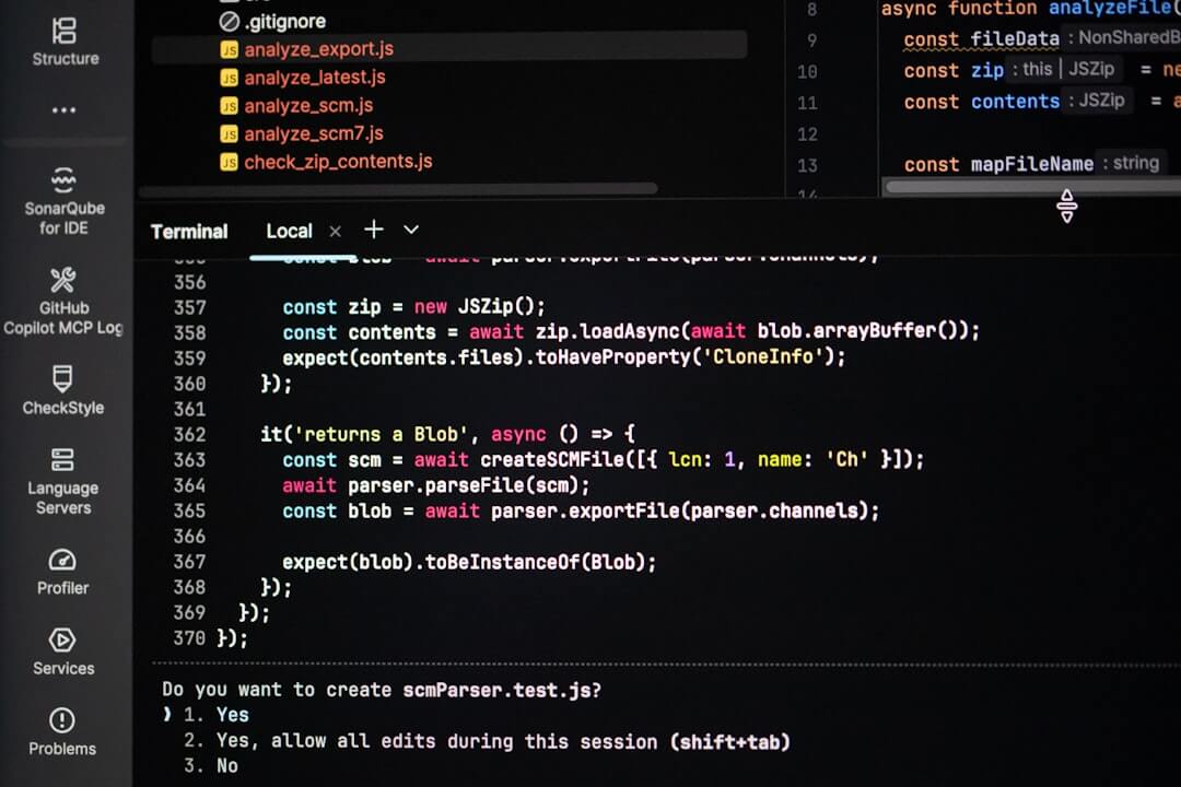 Coding on a dark theme computer screen