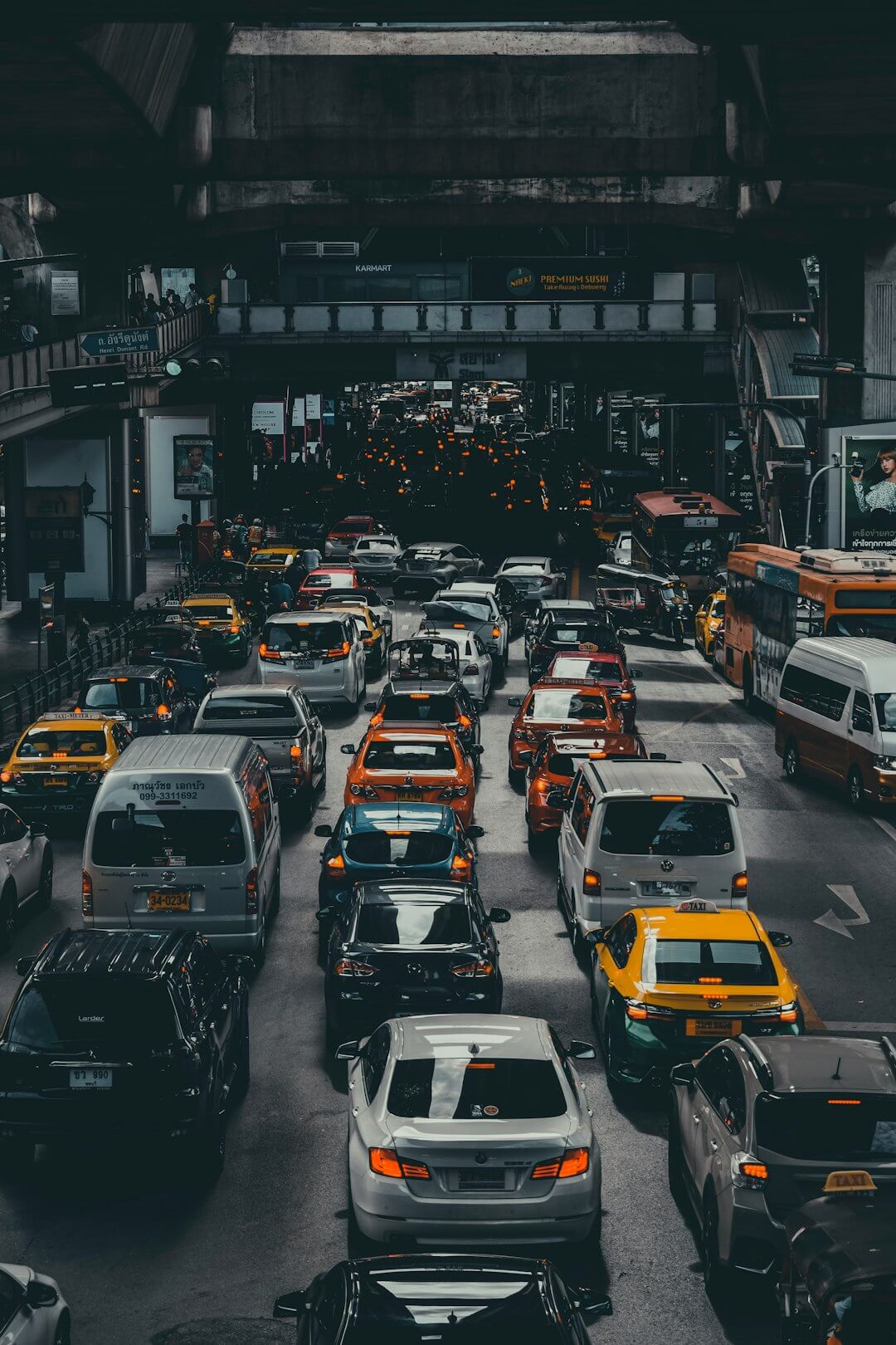 assorted vehicles on road at daytime
