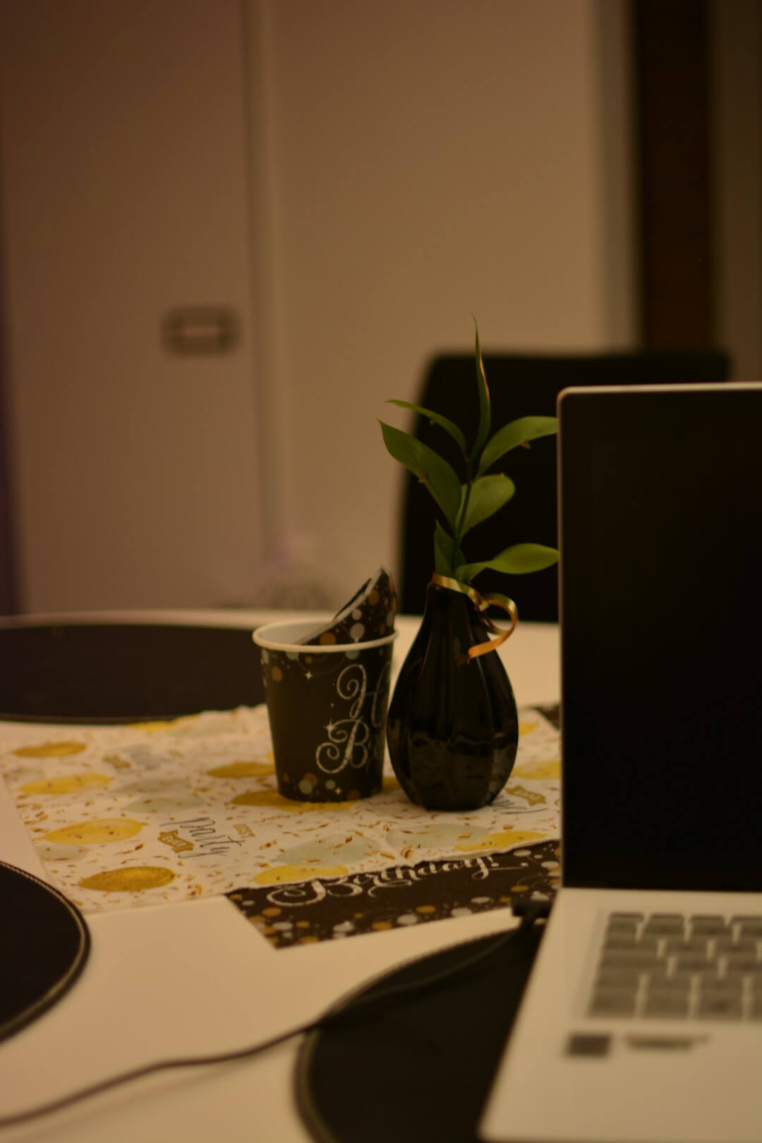 a laptop computer sitting on top of a table