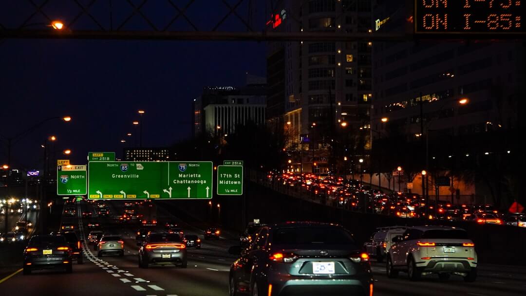 a highway filled with lots of traffic at night