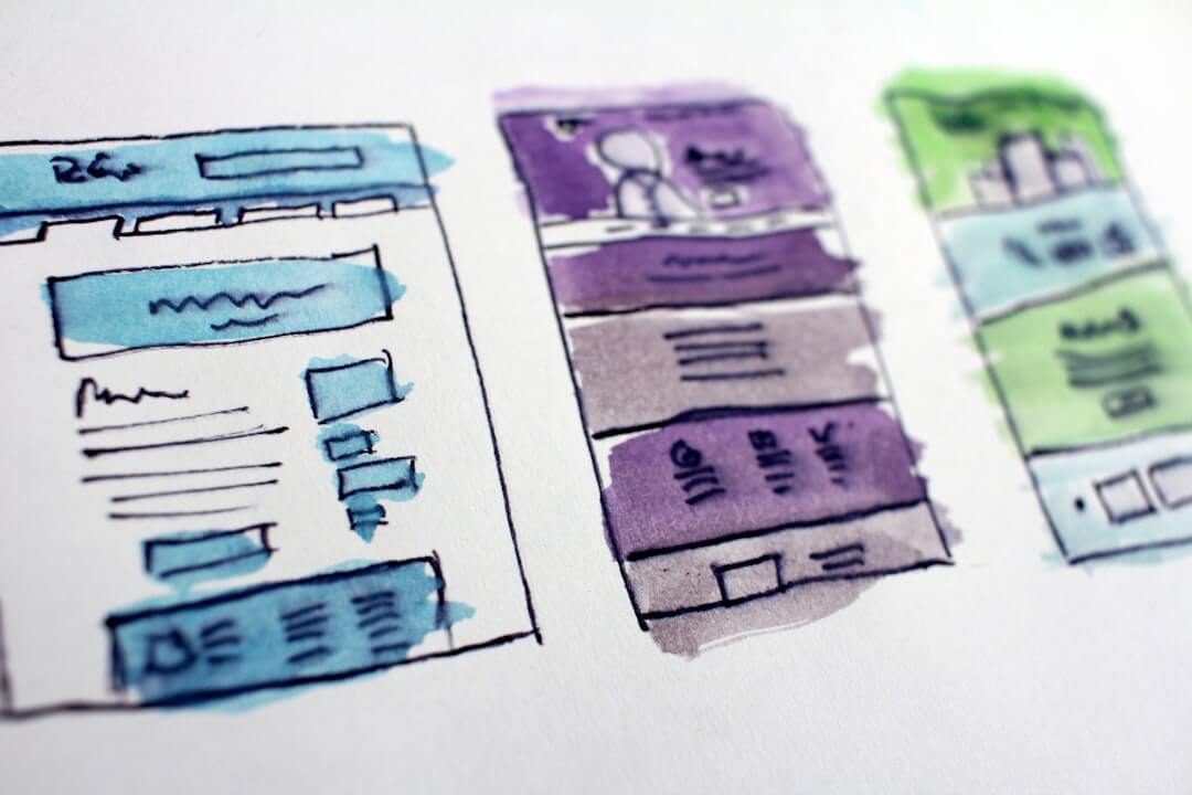 watercolor wireframe sketches of website layouts