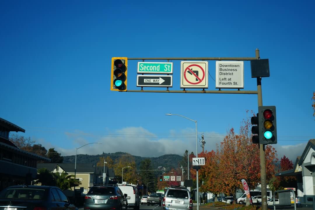 Traffic lights and street signs at an intersection.