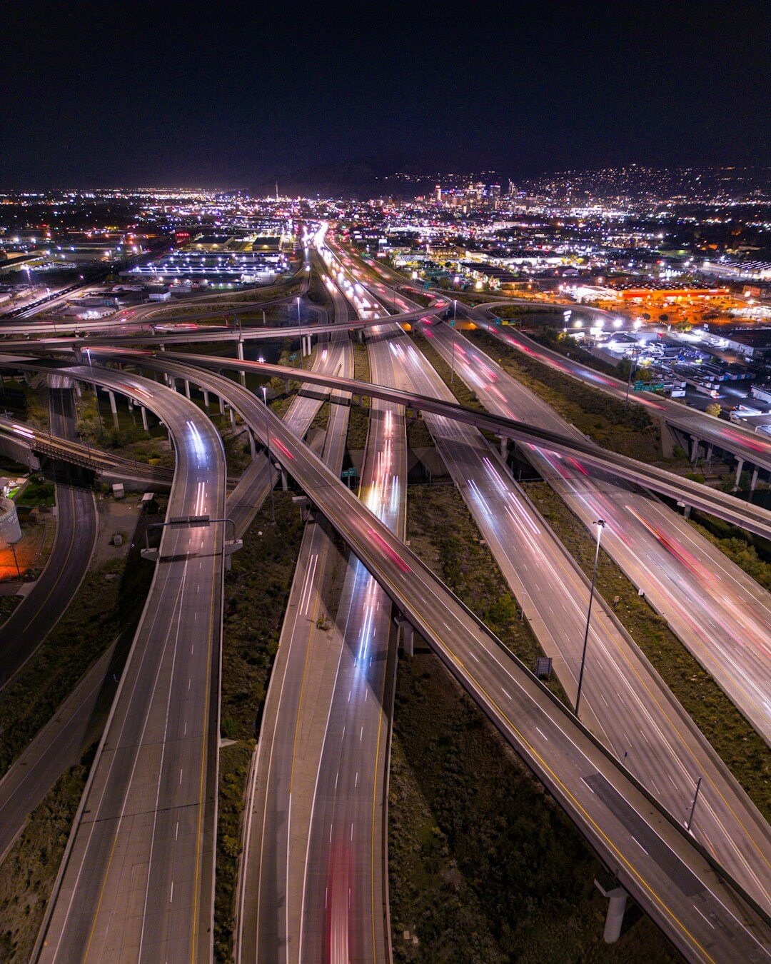 An aerial view of a highway intersection at night