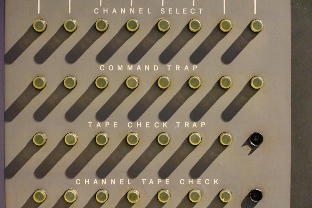 A wall with a bunch of buttons on it