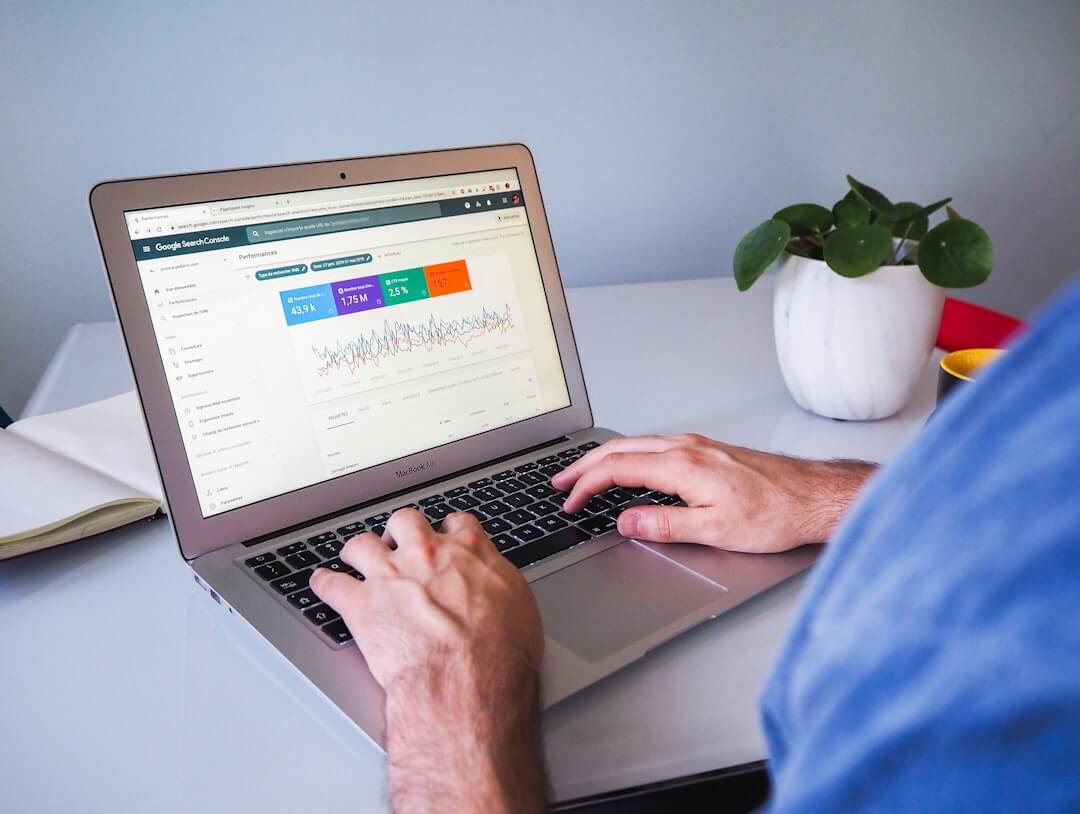 a person typing on a laptop
