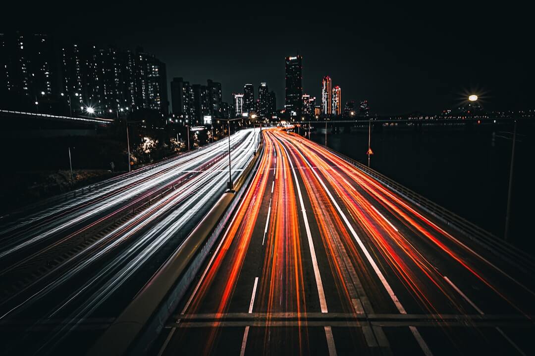 A long exposure photo of a city street at night