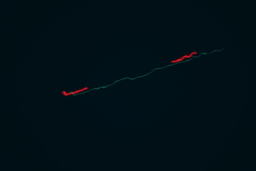 a plane is flying in the sky at night
