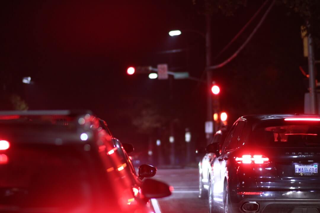 A street filled with lots of traffic at night