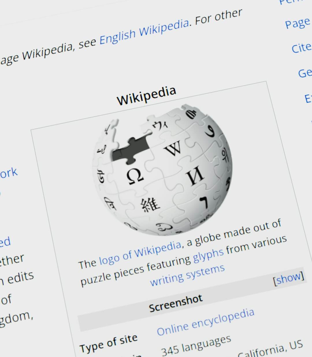 Wikipedia logo globe with text on screen