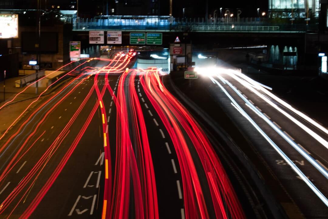 time lapse photography of cars on road during night time
