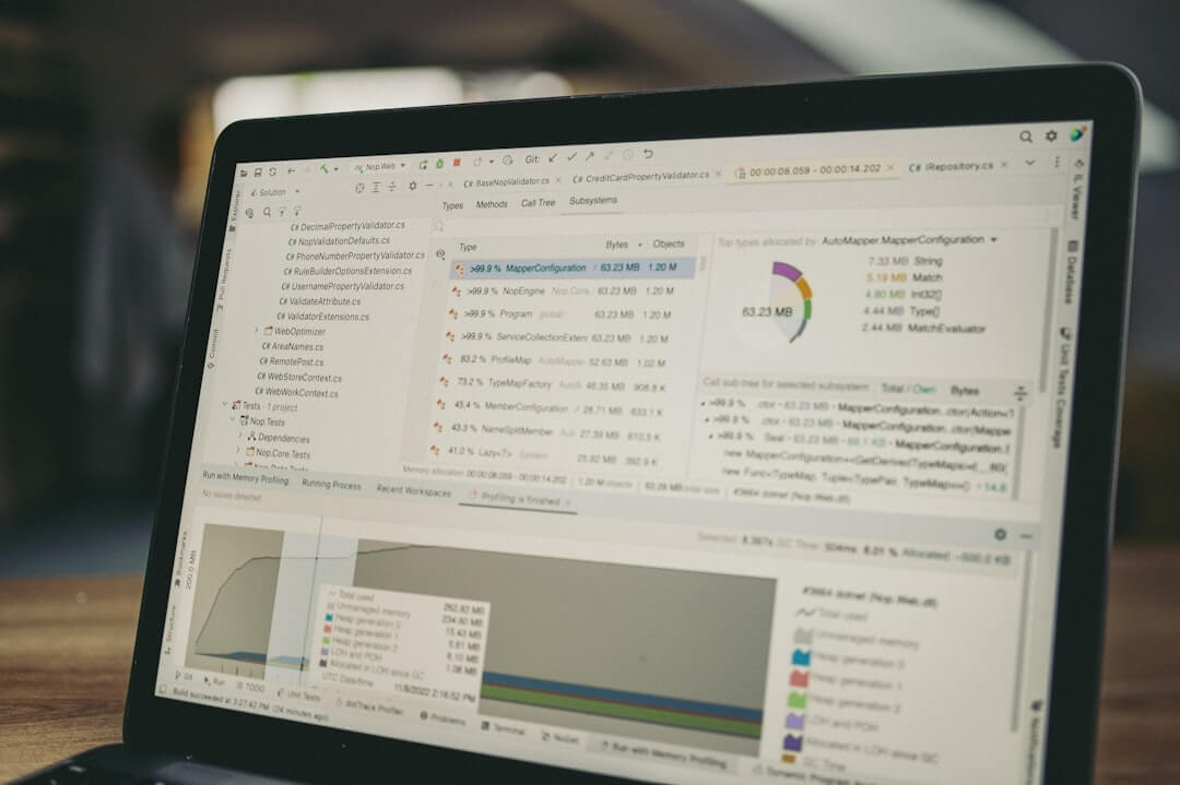 Laptop screen displaying code and data charts