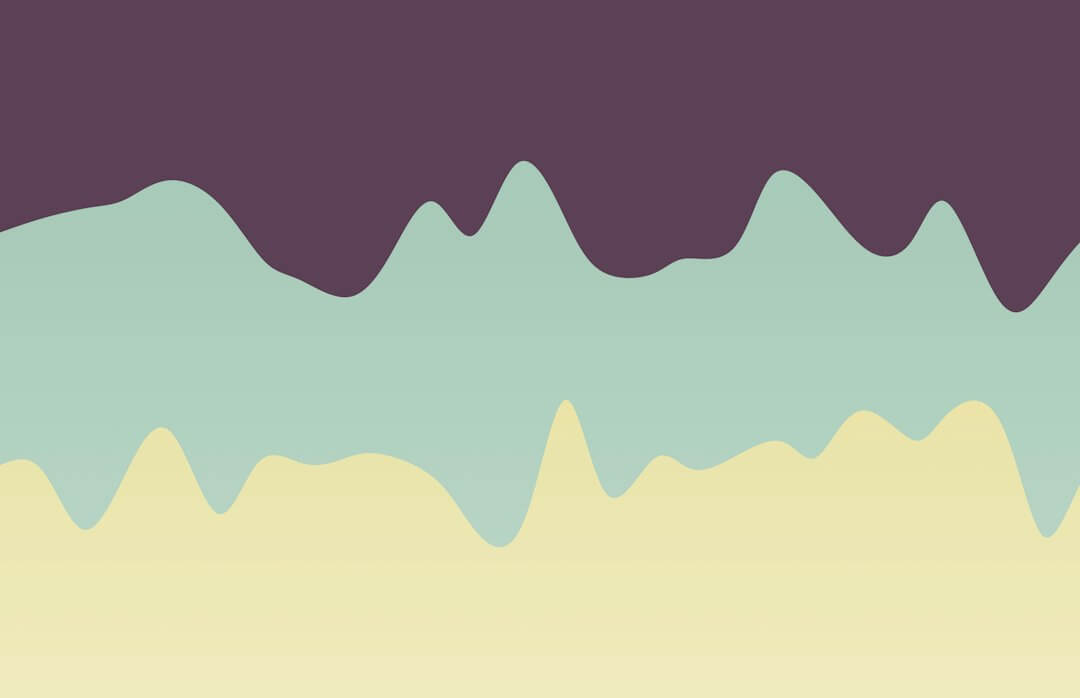 a line of mountains with a sky background