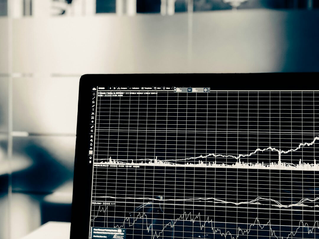 A computer screen displaying a white line graph of financial market data